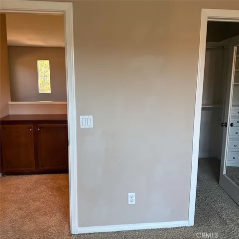 a view of an empty room and closet