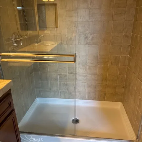 a bathroom with a sink double vanity and a mirror