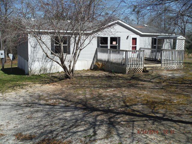 2310 James Peaden Road Baker, FL 32531 - Photo 1 of 7 a view of a small house with a yard