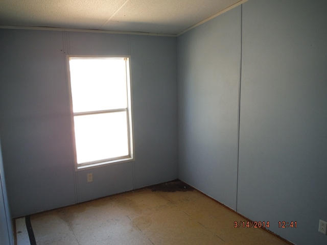 2310 James Peaden Road Baker, FL 32531 - Photo 3 of 7 an empty room with a window