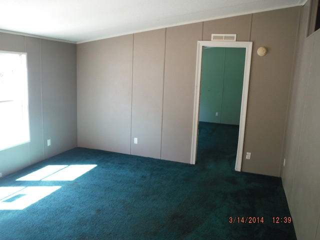 2310 James Peaden Road Baker, FL 32531 - Photo 7 of 7 an empty room with an empty space and window