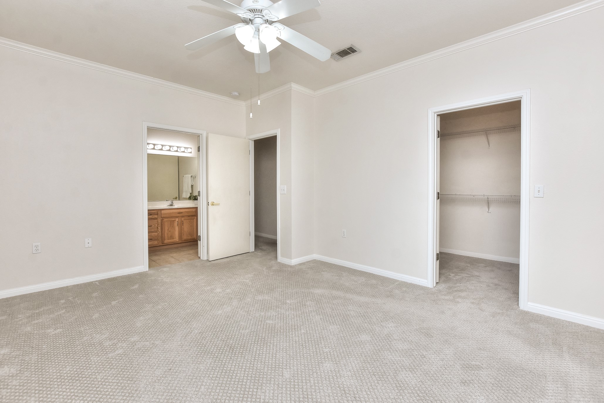 508 Texas Drive Georgetown, TX 78633 - Photo 10 of 14 A comfortable bedroom with plush carpeting features an adjacent bathroom and a spacious walk-in closet.