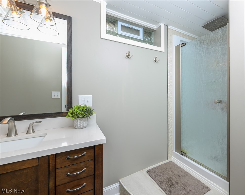 2383 Sunnybrook Road Mogadore, OH 44260 - Photo 27 of 31 Bathroom with a shower with shower door, mirror, and vanity