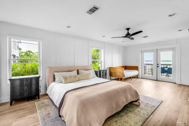 a bedroom with bed and window