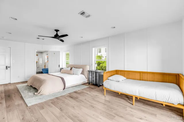 a bedroom with a bed and dresser