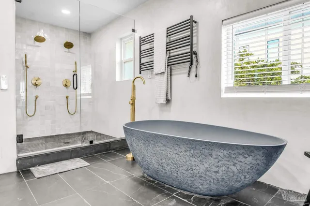 a living room with couch and dining table