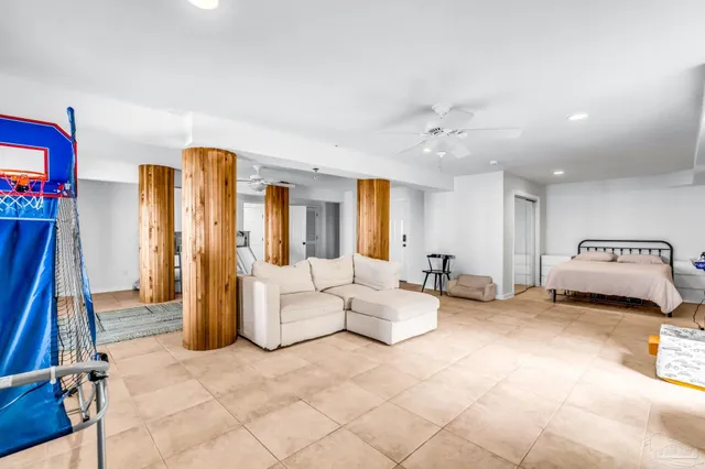 a bedroom with a bed and a couch