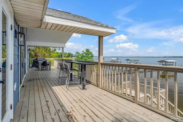 a patio with wooden floor and outdoor space