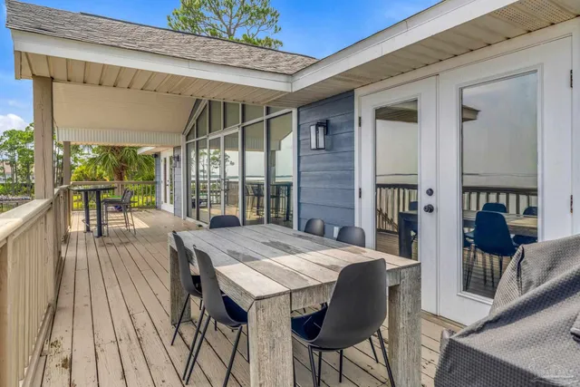 a view of a balcony with wooden floor