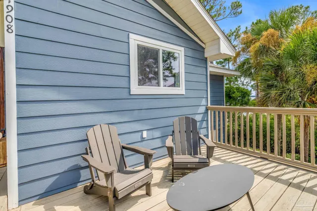 an aerial view of a house with a swimming pool yard and mountain view in back