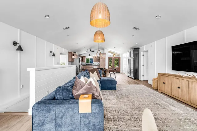 a living room with fireplace furniture and a flat screen tv