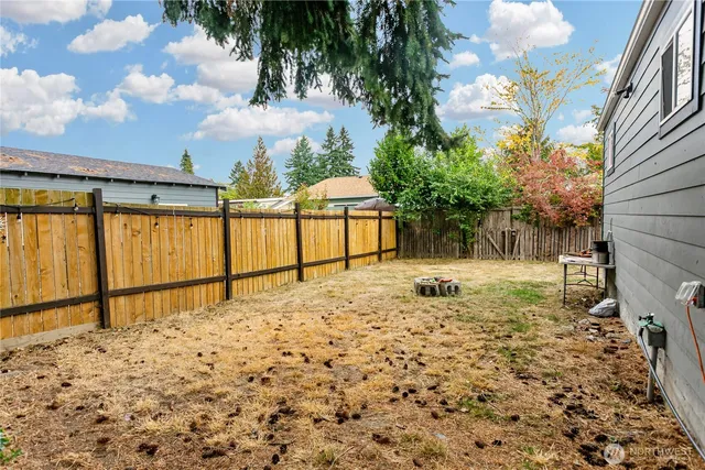 a view of a backyard of the house