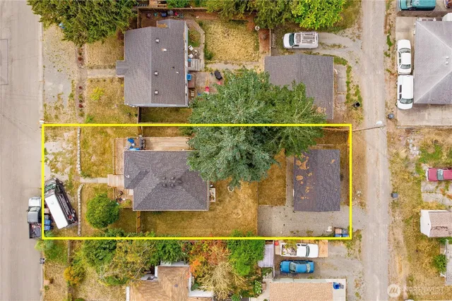 an aerial view of residential houses with outdoor space