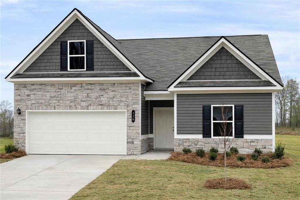a front view of a house with a yard