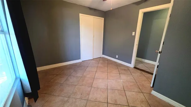 a view of a kitchen from the hallway