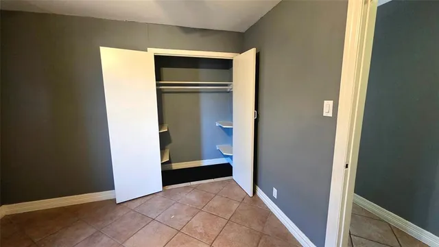 a view of an empty room with windows