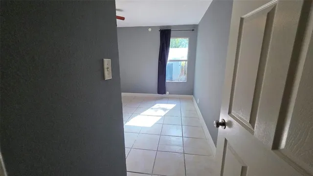 a view of an empty room and window