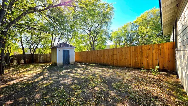 a view of a street with a building in the background