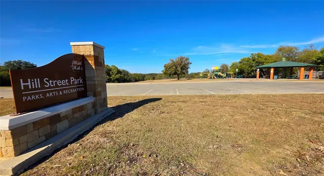 a view of a patio with chairs and table