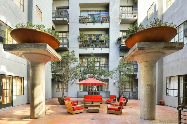 a view of a two of cars parked in front of a building
