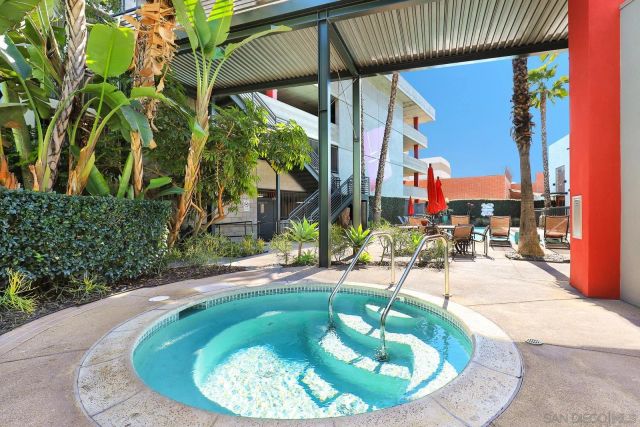 a view of a swimming pool with sitting area