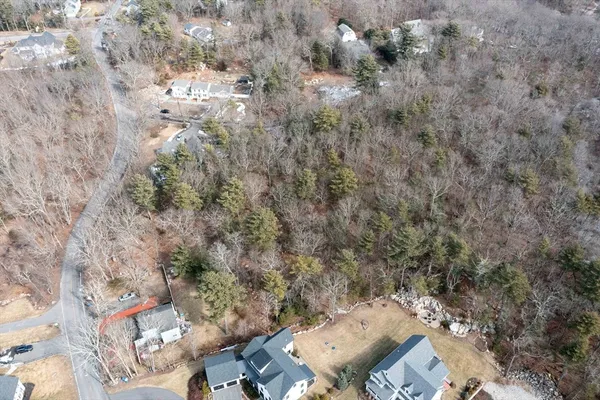 an aerial view of a house with yard and outdoor seating