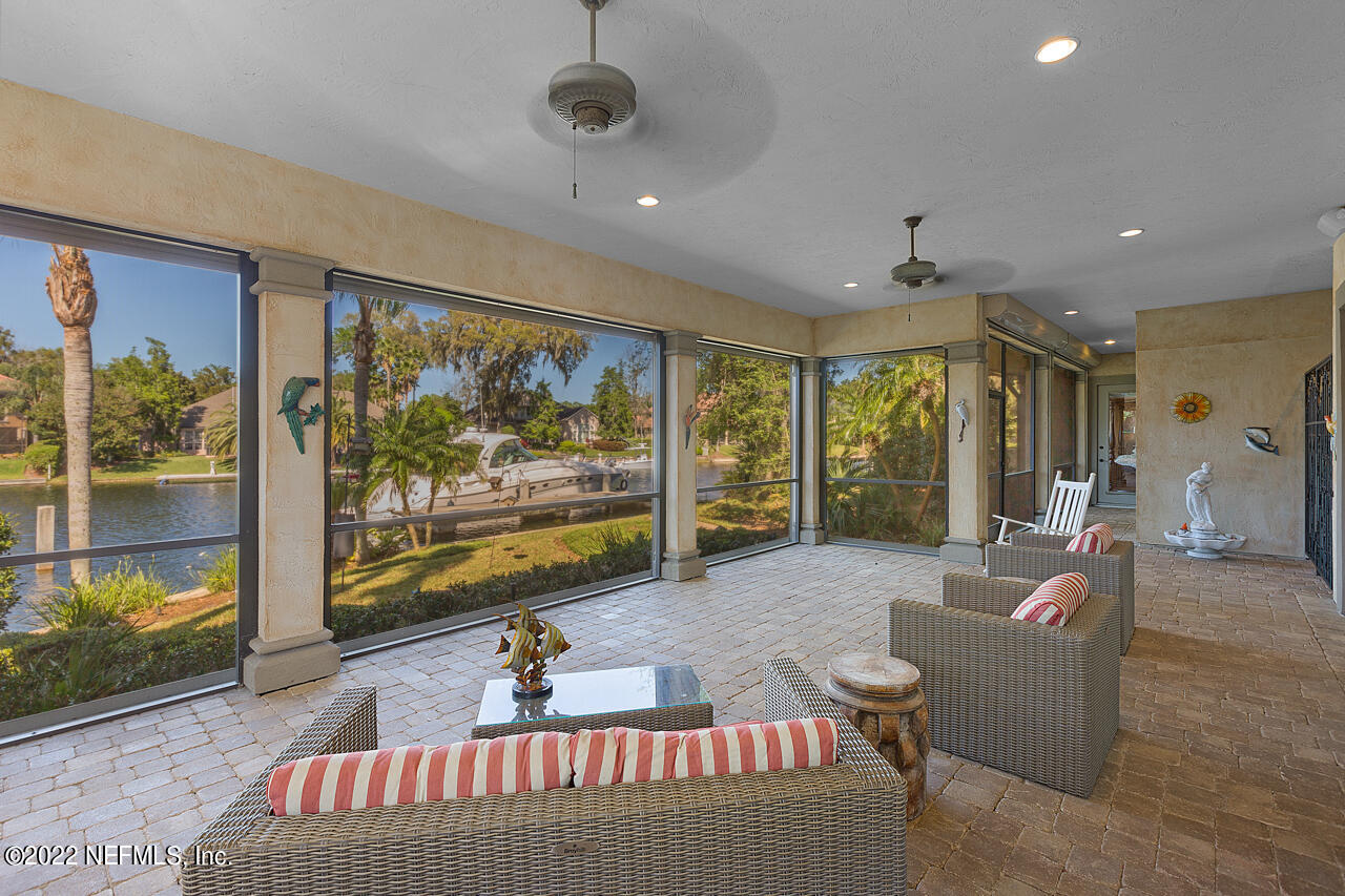 13639 Queens Harbor Boulevard Jacksonville, FL 32225 - Photo 40 of 59 Large screened lanai from family room