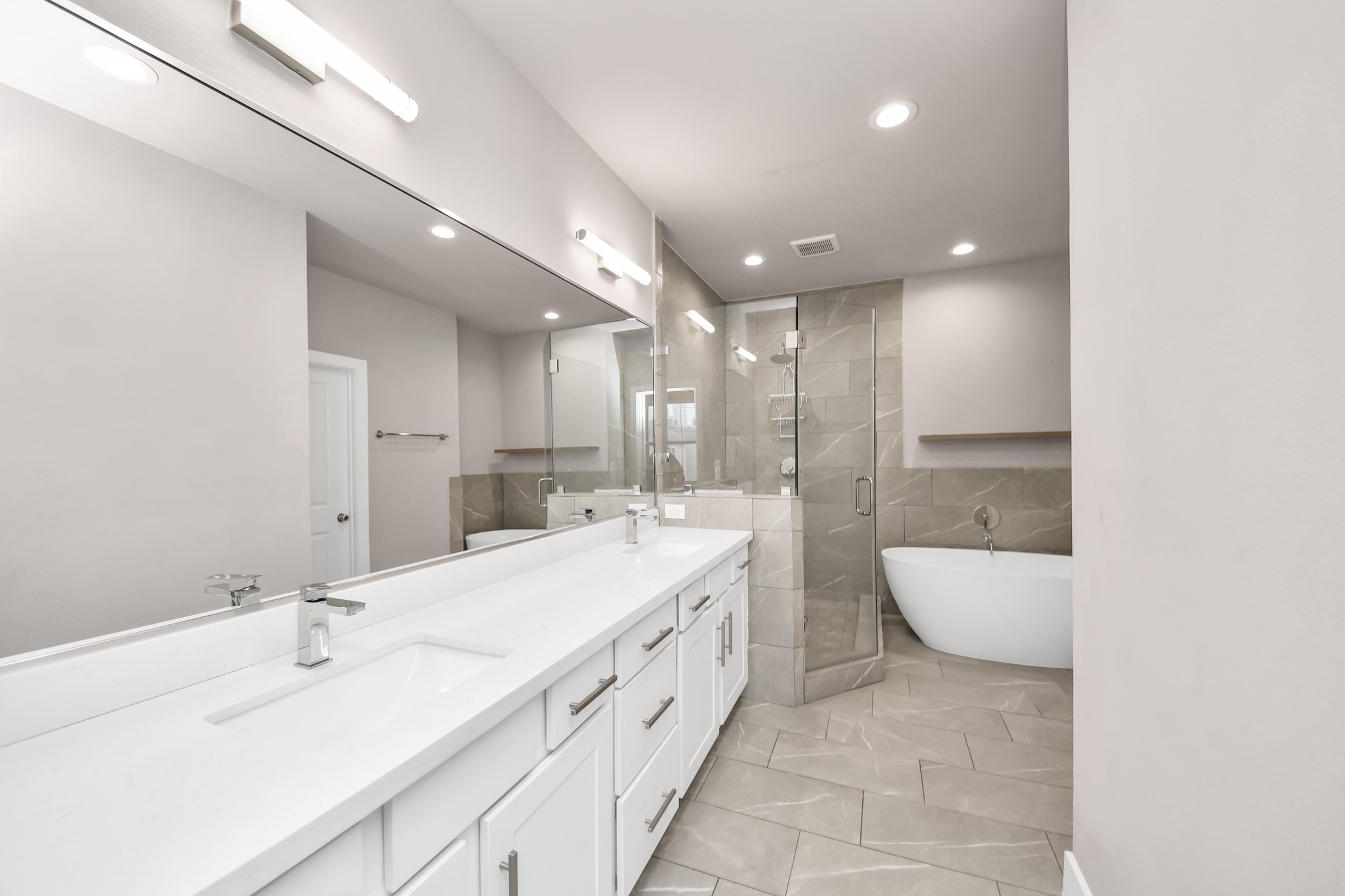 2114 Stuart Street Houston, TX 77004 - Photo 31 of 39 a bathroom with a double vanity sink and mirror