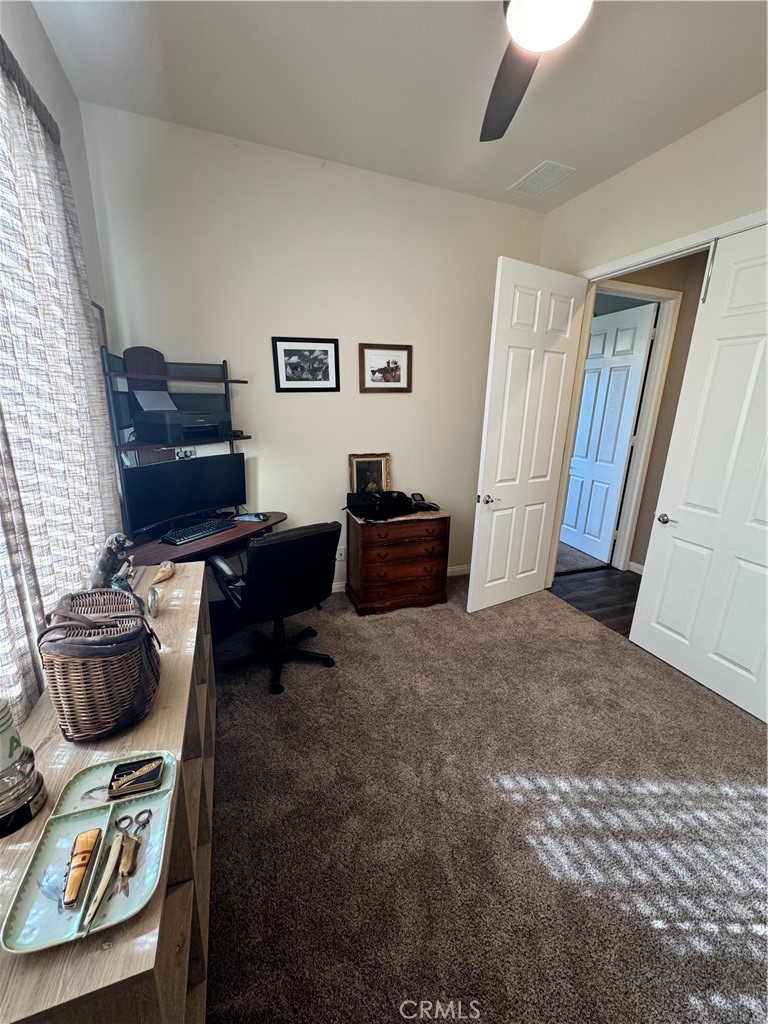 11000 Rockaway Glen Road Apple Valley, CA 92308 - Photo 12 of 17 a living room with furniture and a flat screen tv