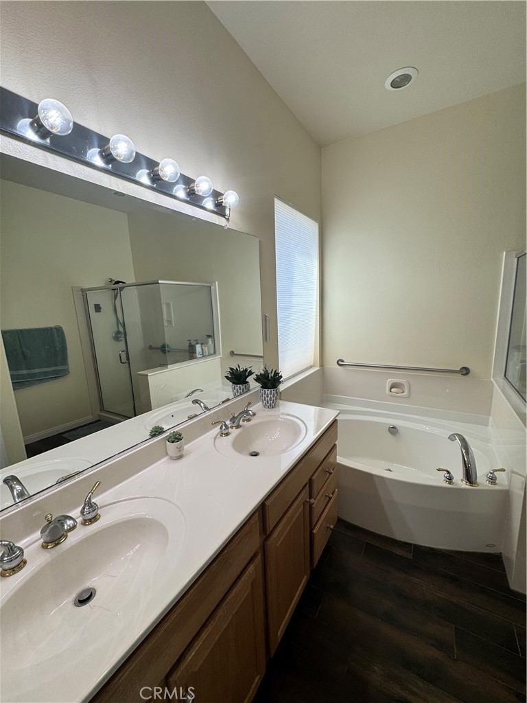11000 Rockaway Glen Road Apple Valley, CA 92308 - Photo 14 of 17 a bathroom with a double vanity sink and a mirror