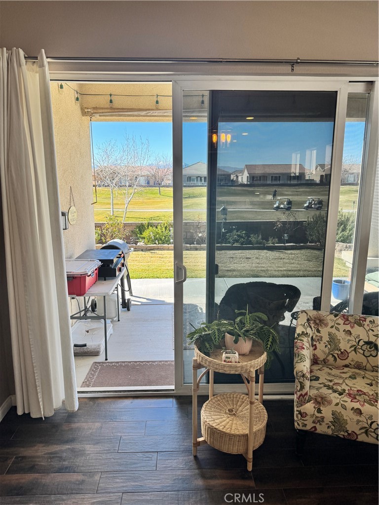 11000 Rockaway Glen Road Apple Valley, CA 92308 - Photo 15 of 17 a living room with furniture and a fireplace