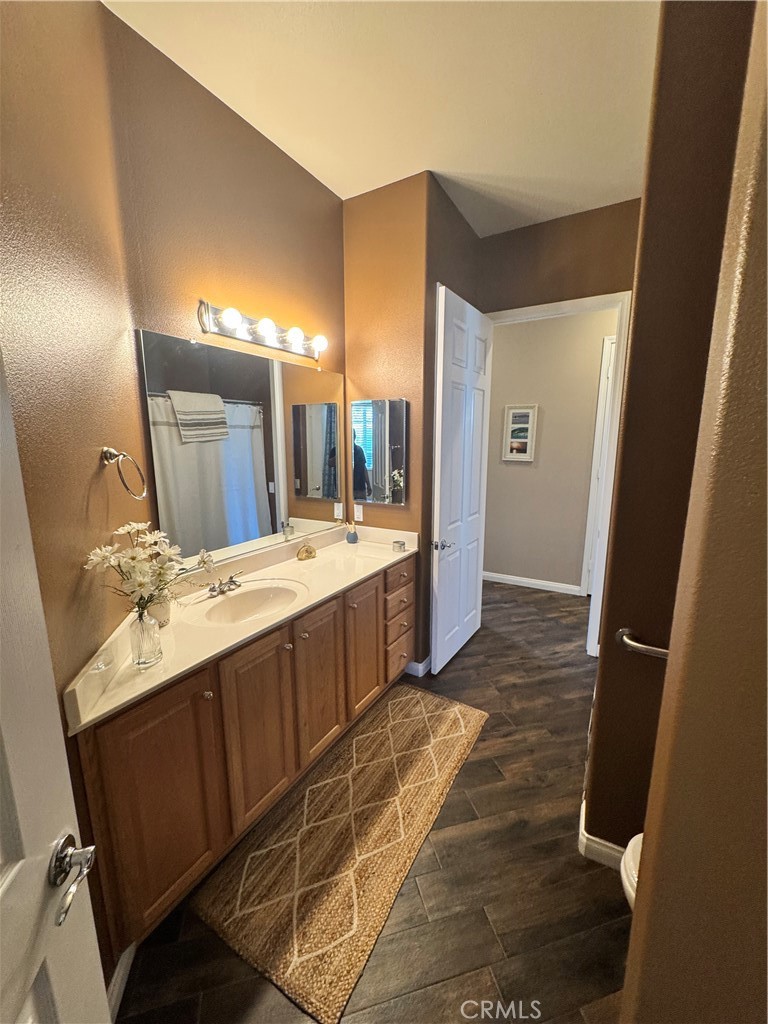 11000 Rockaway Glen Road Apple Valley, CA 92308 - Photo 8 of 17 a bathroom with a double vanity sink and mirror