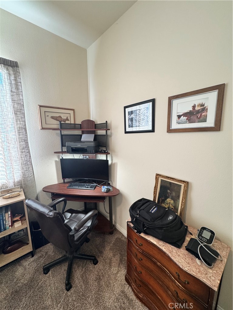 11000 Rockaway Glen Road Apple Valley, CA 92308 - Photo 10 of 17 a view of workspace with wooden floor and black living room