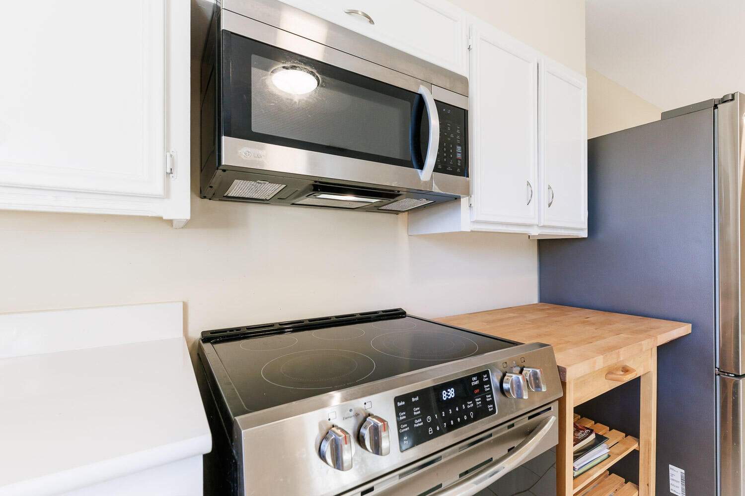 3603 77th Drive Lubbock, TX 79423 - Photo 19 of 72 a stove top oven sitting inside of a kitchen