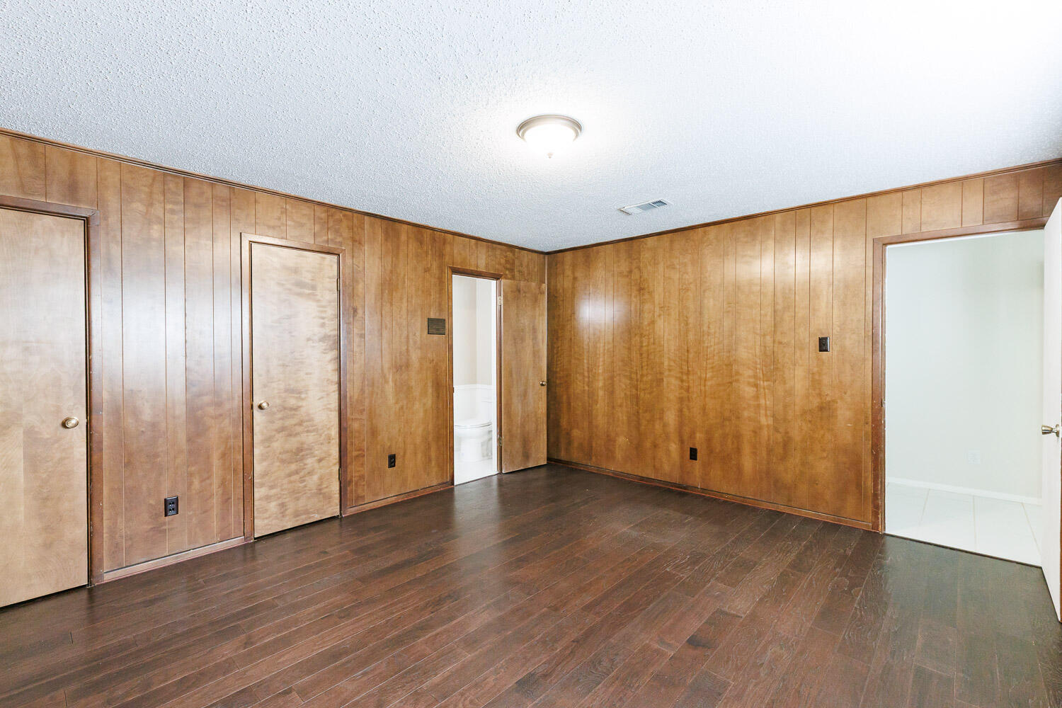 3603 77th Drive Lubbock, TX 79423 - Photo 49 of 72 a view of an empty room with wooden floor