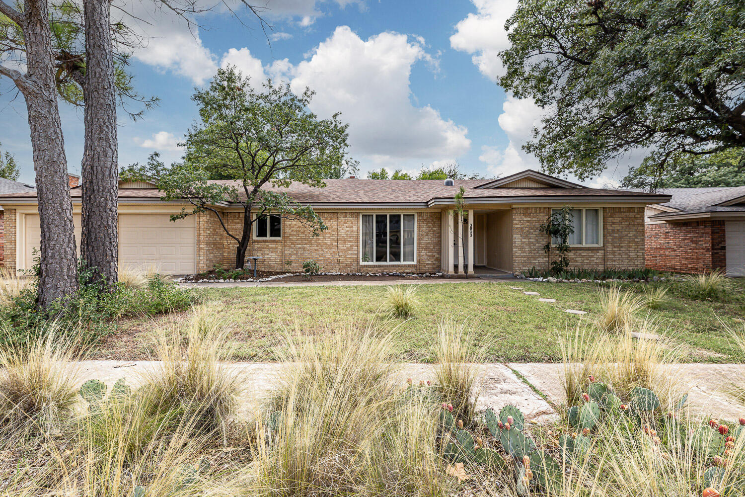 3603 77th Drive Lubbock, TX 79423 - Photo 70 of 72 a front view of a house with a yard