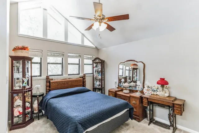 a bedroom with furniture and window