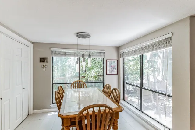 a view of a city from a dining room with furniture window and outside view