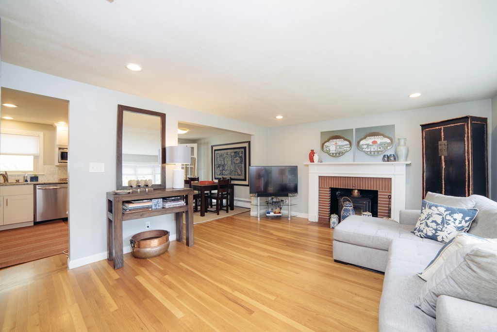 2 Janet Road Arlington, MA 02474 - Photo 2 of 25 a living room with furniture and a fireplace