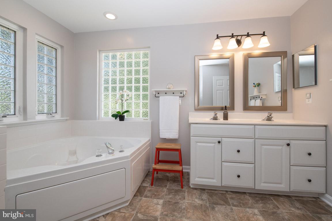 125 South Hilltop Road Baltimore, MD 21228 - Photo 34 of 66 Spa bath with glass block