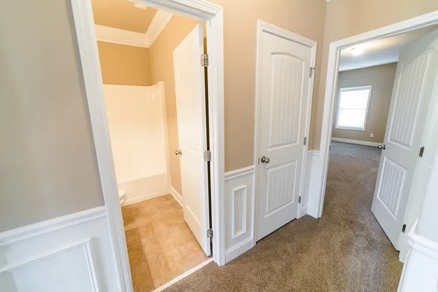 a kitchen with kitchen island granite countertop a sink stove and refrigerator