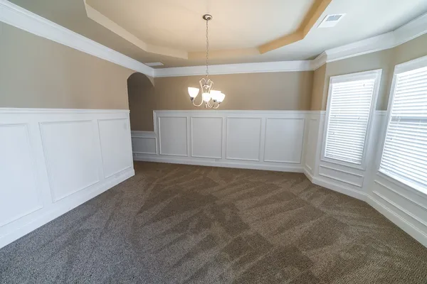 a view of a livingroom with a ceiling fan and window