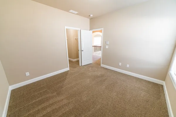 an empty room with a mirror