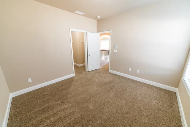 an empty room with a mirror