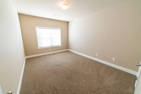 a view of a hallway with windows