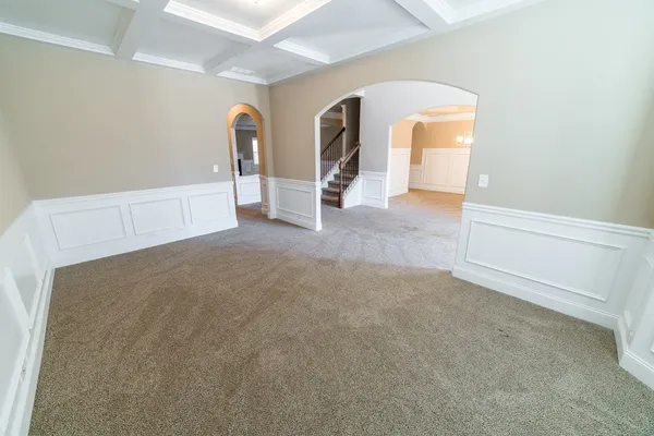 a view of a livingroom with an empty space and a fireplace