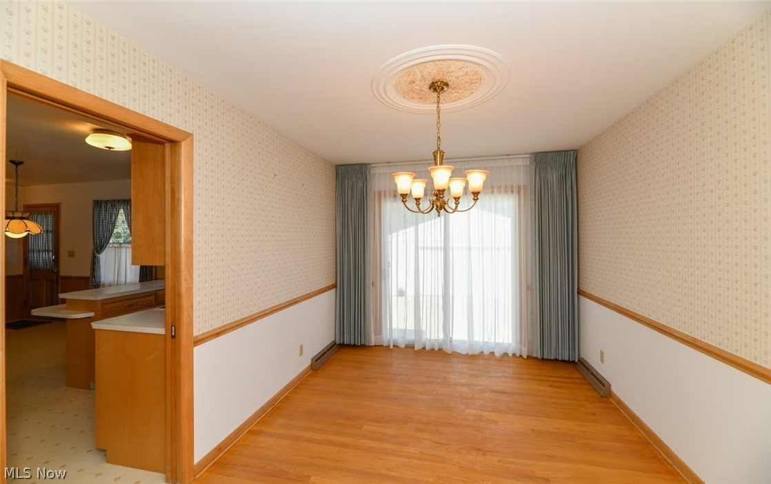 2511 Burnham Road Akron, OH 44333 - Photo 6 of 33 Dining room with hardwood floors, chair rail and slider to back