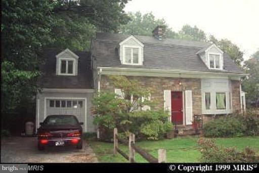 8905 Flower Avenue Silver Spring, MD 20901 - Photo 11 of 17 a front view of a house with a garden