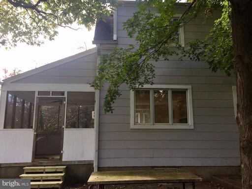 8905 Flower Avenue Silver Spring, MD 20901 - Photo 16 of 17 a front view of a house with a yard