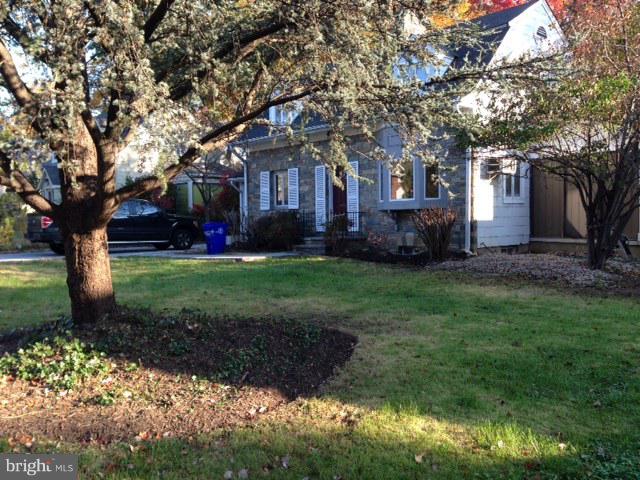 8905 Flower Avenue Silver Spring, MD 20901 - Photo 3 of 17 a front view of a house with a garden